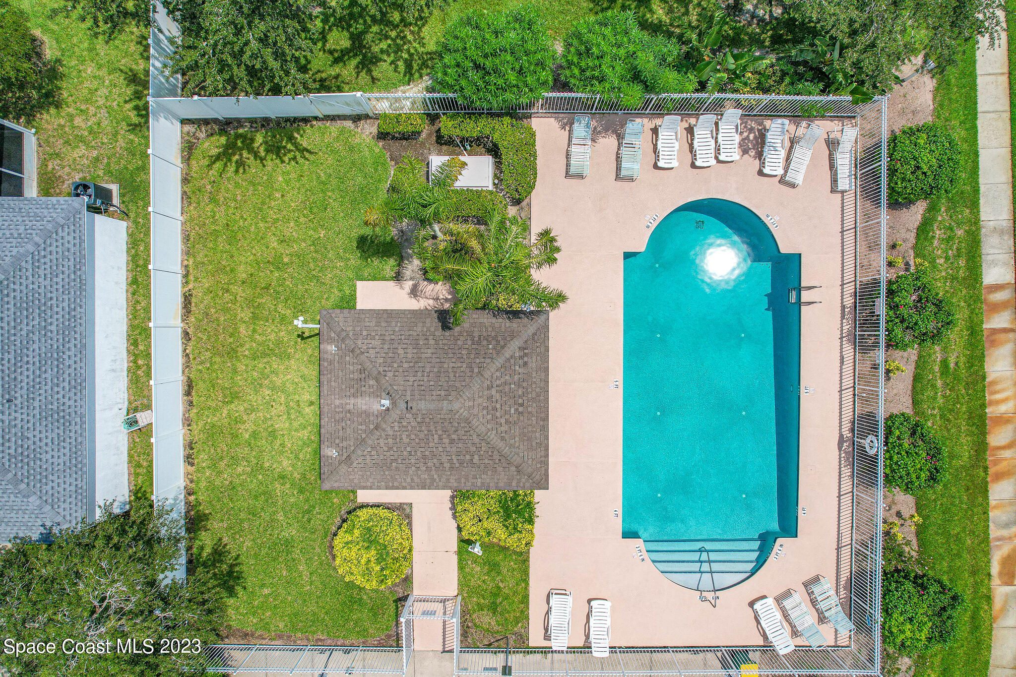 1149 White Oak Circle Melbourne, FL 32934 - Photo 50 of 55 a front view of a house with garden