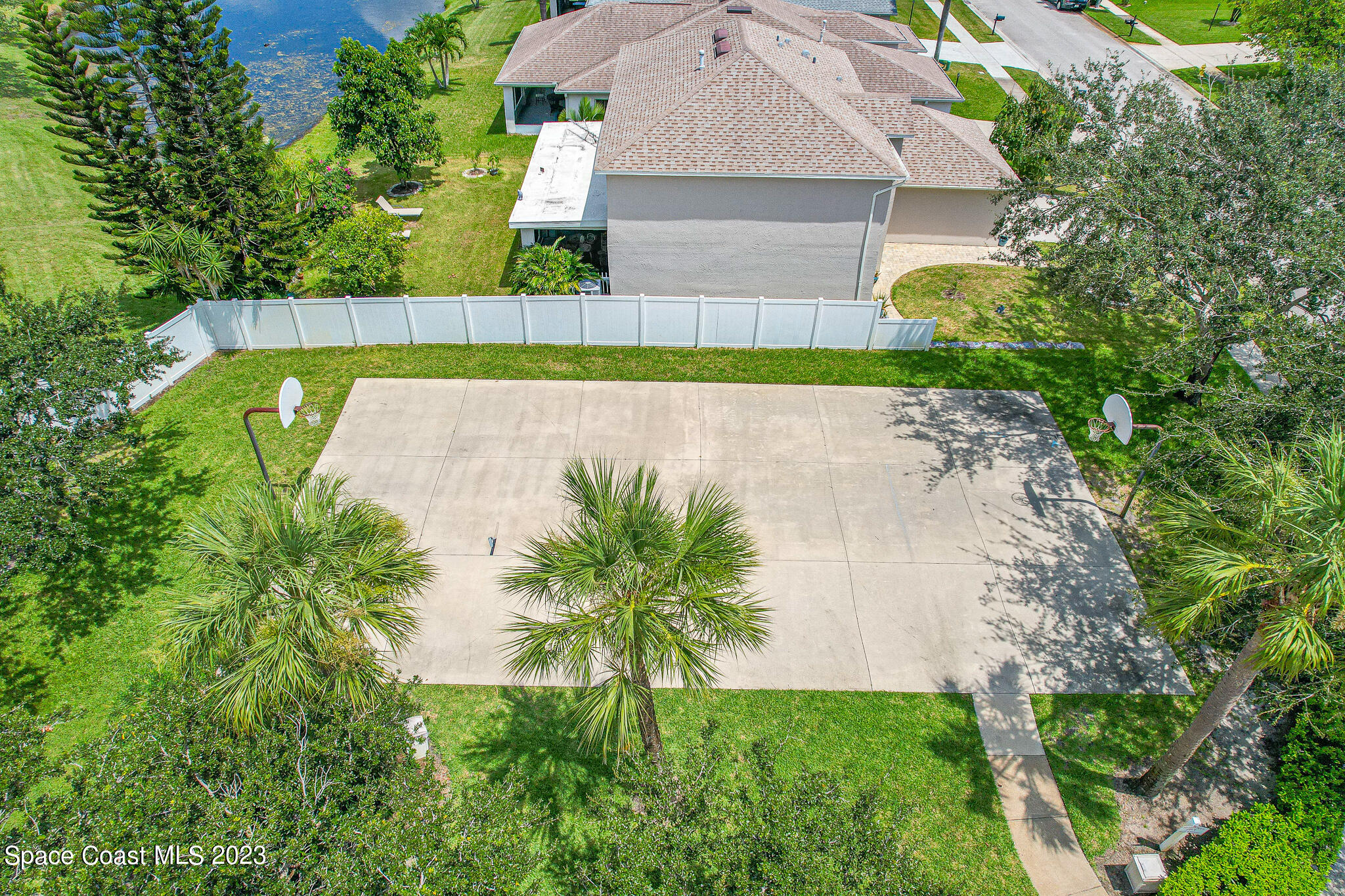1149 White Oak Circle Melbourne, FL 32934 - Photo 52 of 55 an aerial view of a house with a swimming pool