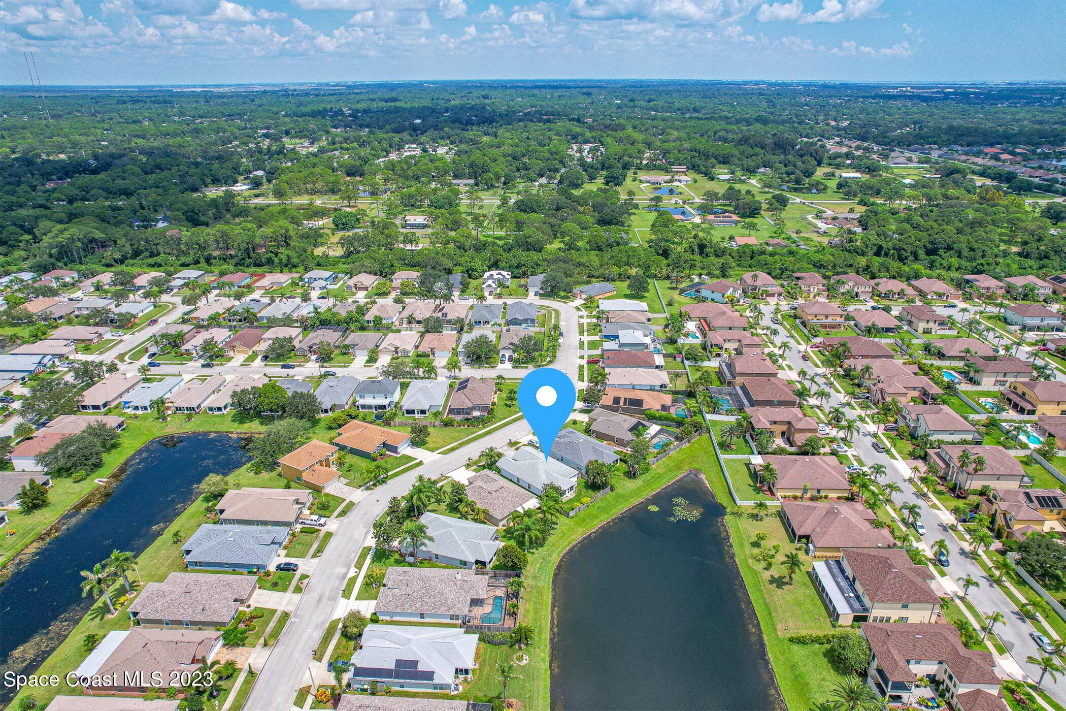 1149 White Oak Circle Melbourne, FL 32934 - Photo 55 of 55 an aerial view of multiple house