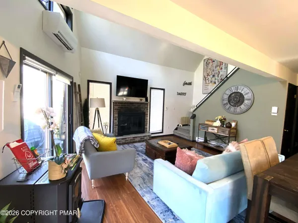 a living room with furniture and a large window