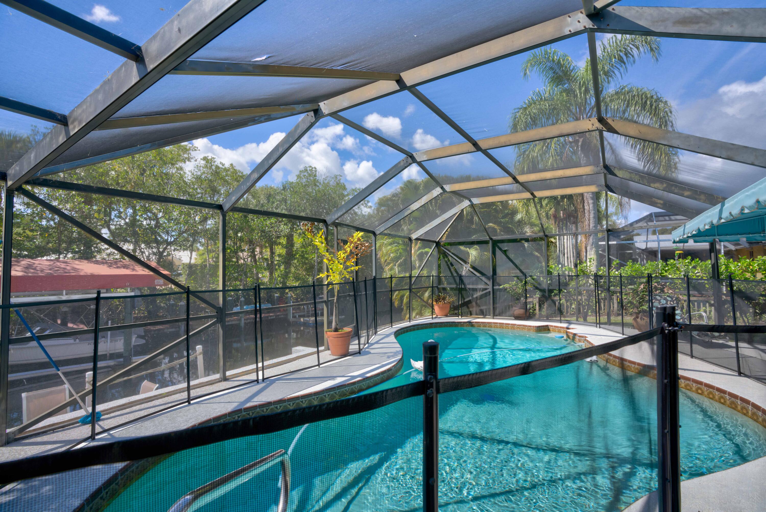 9524 Southeast Cove Point Street Jupiter, FL 33469 - Photo 8 of 58 Screened pool