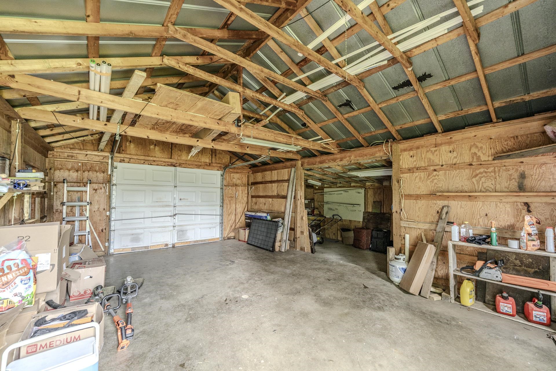 3275 Glendale Road Adamsville, TN 38310 - Photo 38 of 39 a view of a garage with storage