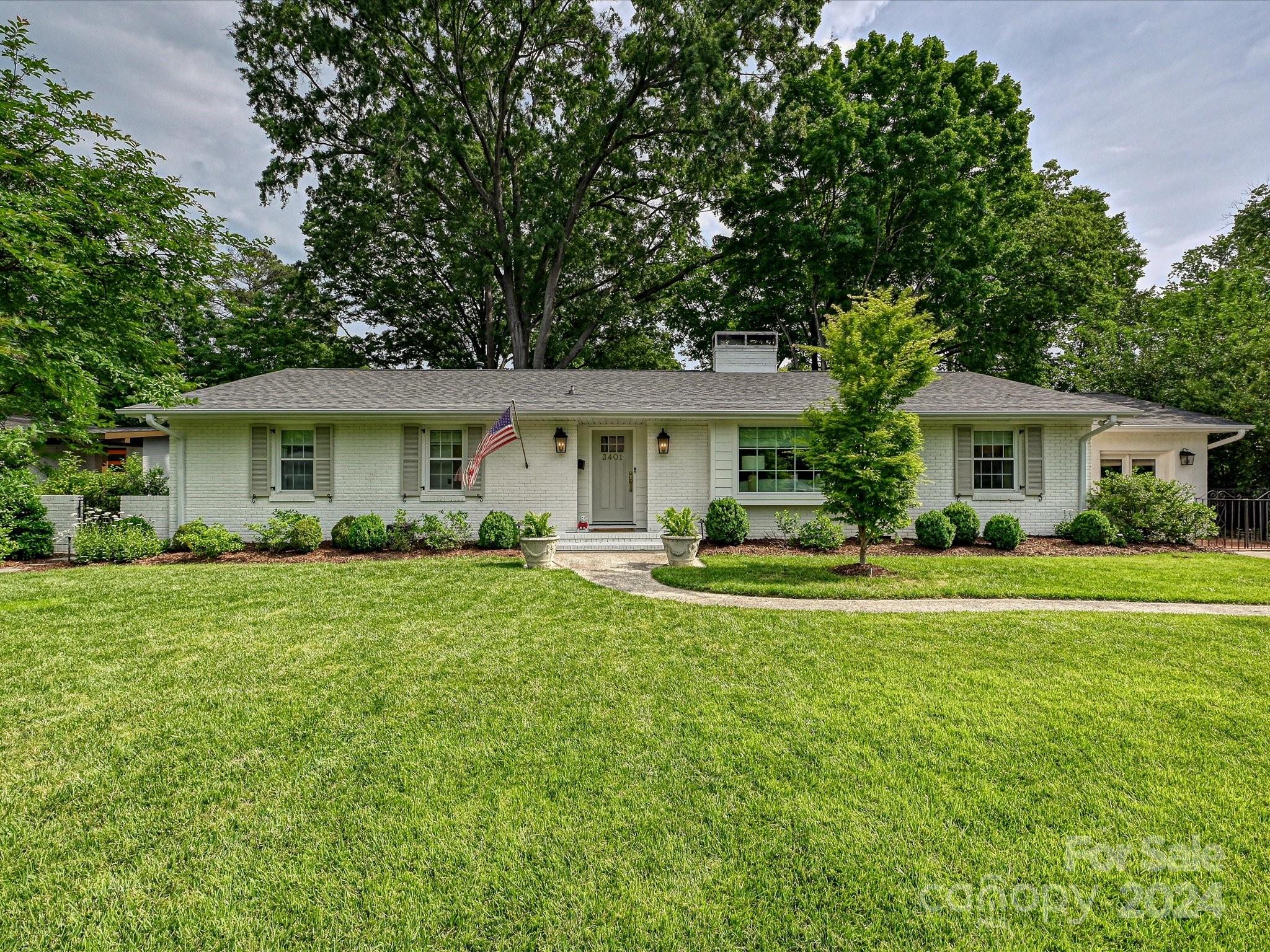3401 Eastburn Road Charlotte, NC 28210 - Photo 1 of 43 a front view of a house with a garden