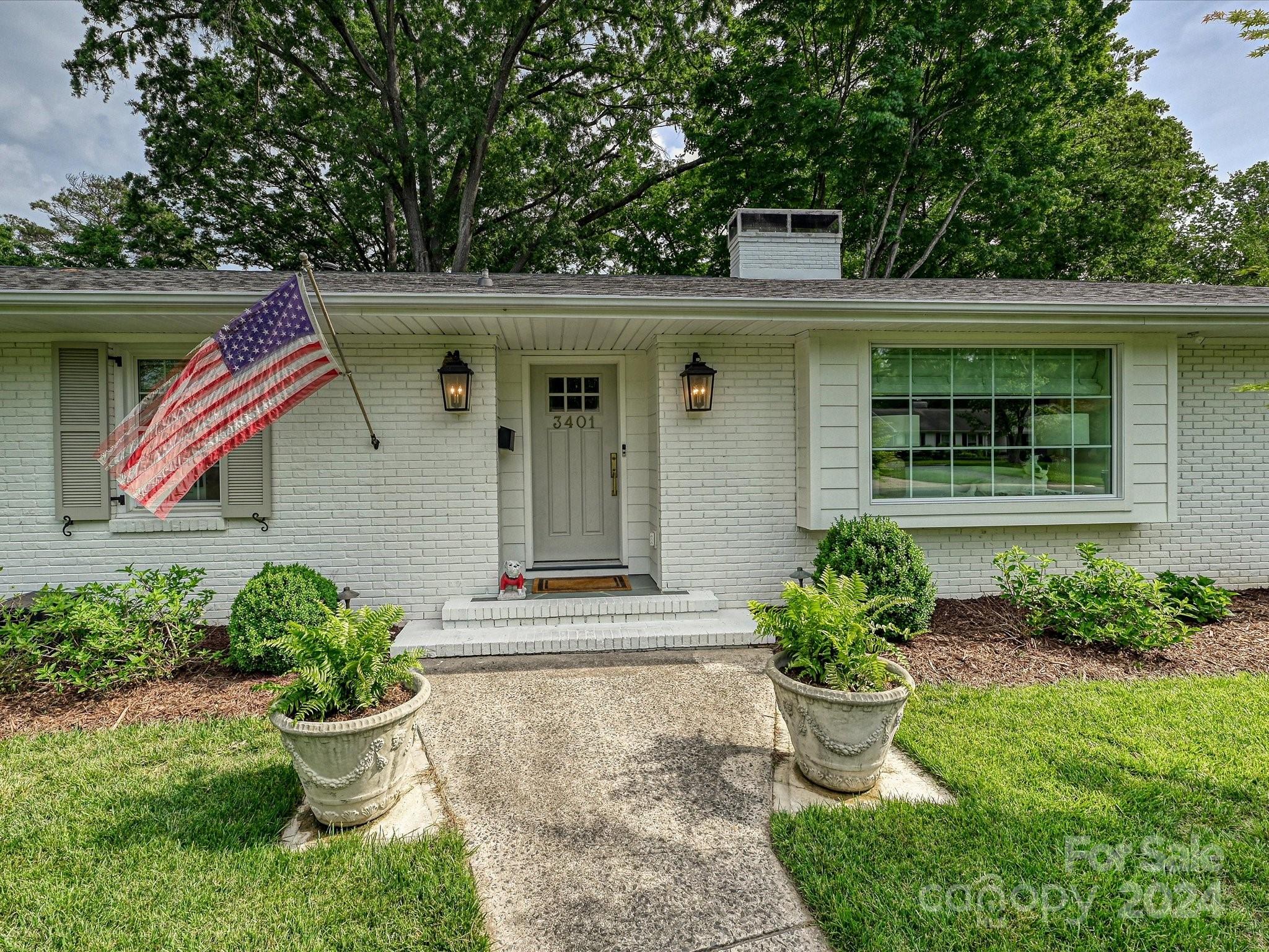 3401 Eastburn Road Charlotte, NC 28210 - Photo 2 of 43 a front view of a house with a garden