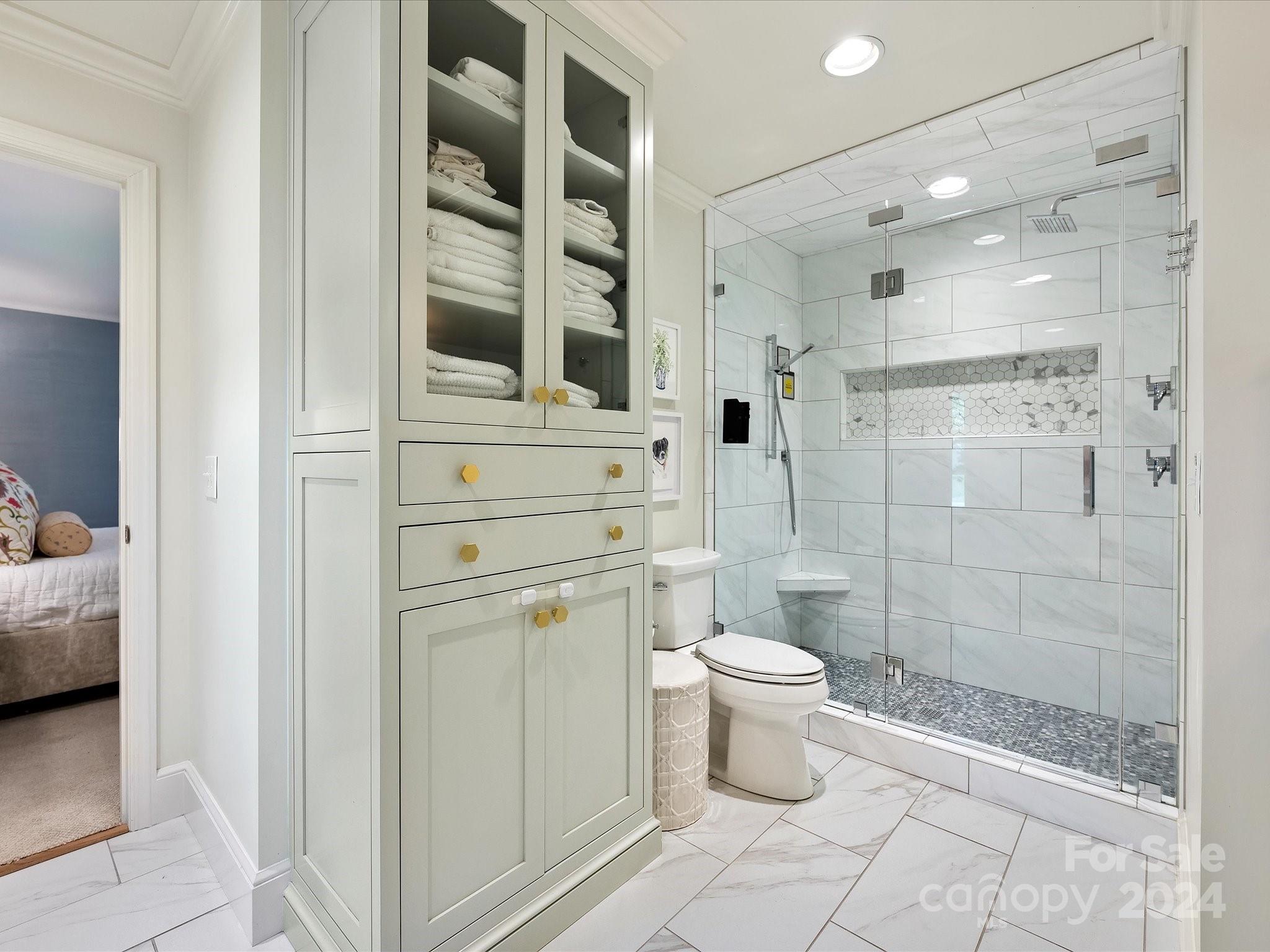 3401 Eastburn Road Charlotte, NC 28210 - Photo 31 of 43 a bathroom with a toilet and a shower