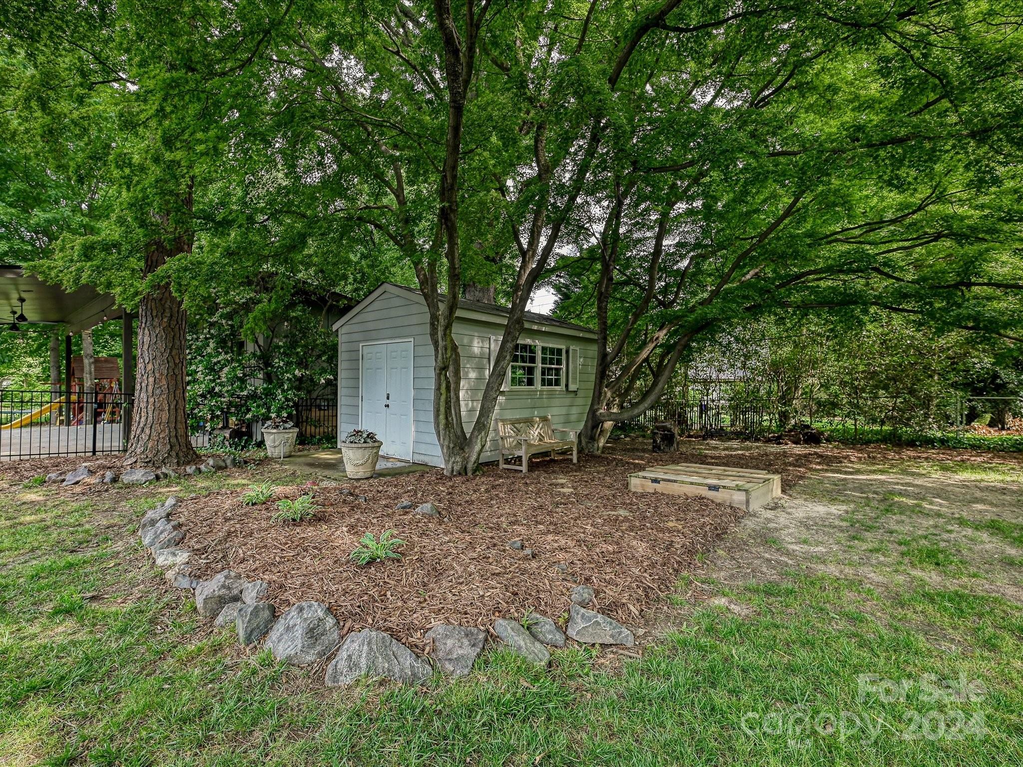 3401 Eastburn Road Charlotte, NC 28210 - Photo 38 of 43 a house with trees in the background