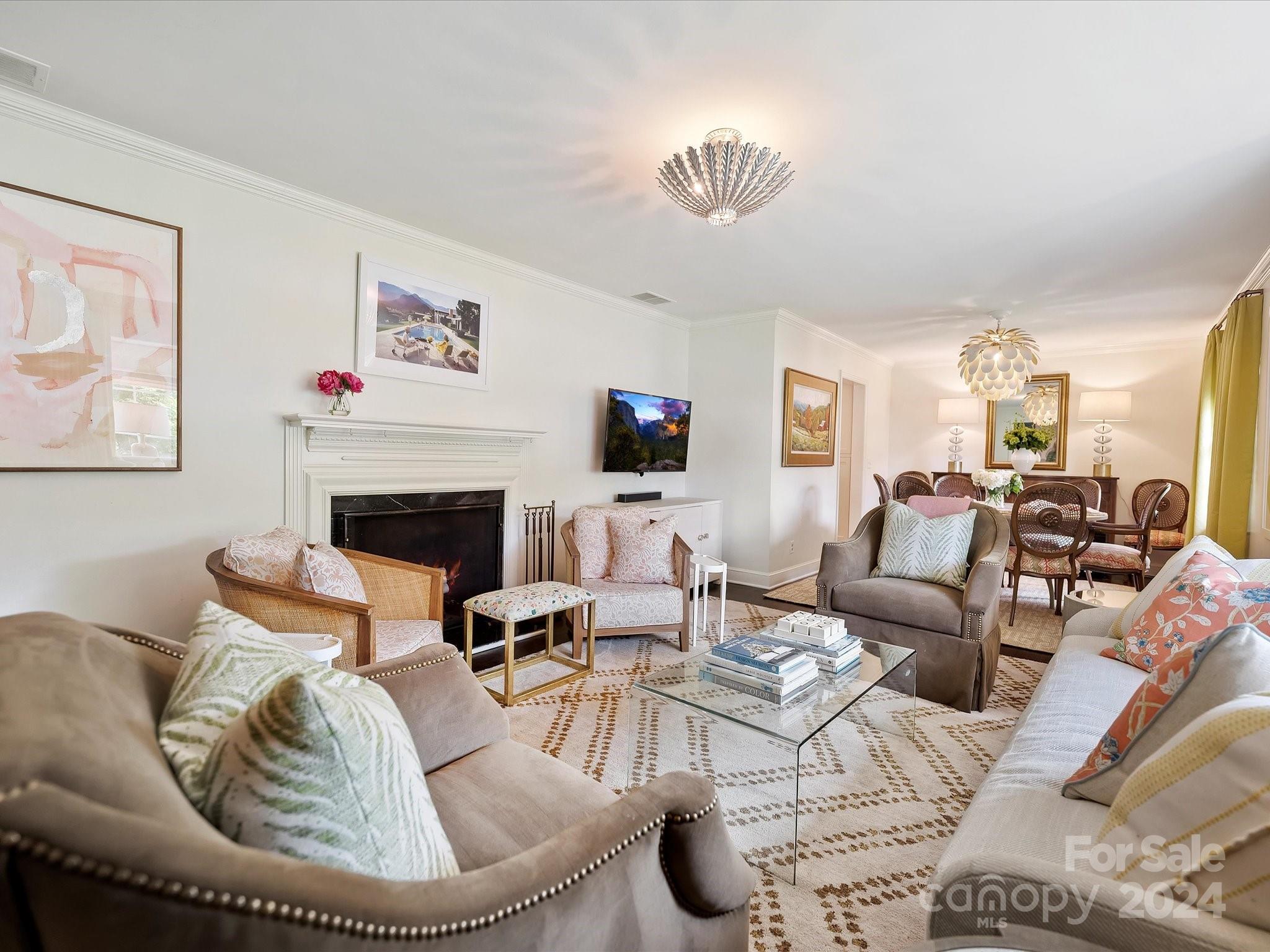3401 Eastburn Road Charlotte, NC 28210 - Photo 6 of 43 a living room with furniture a fireplace and a flat screen tv