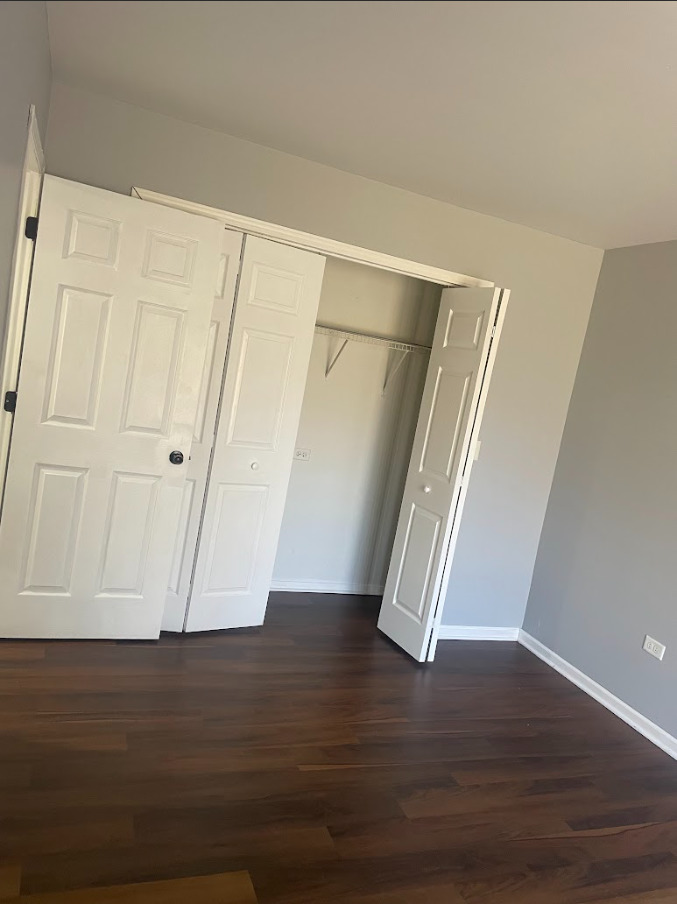 1221 Springdale Circle Naperville, IL 60564 - Photo 8 of 13 wooden floor in an empty room