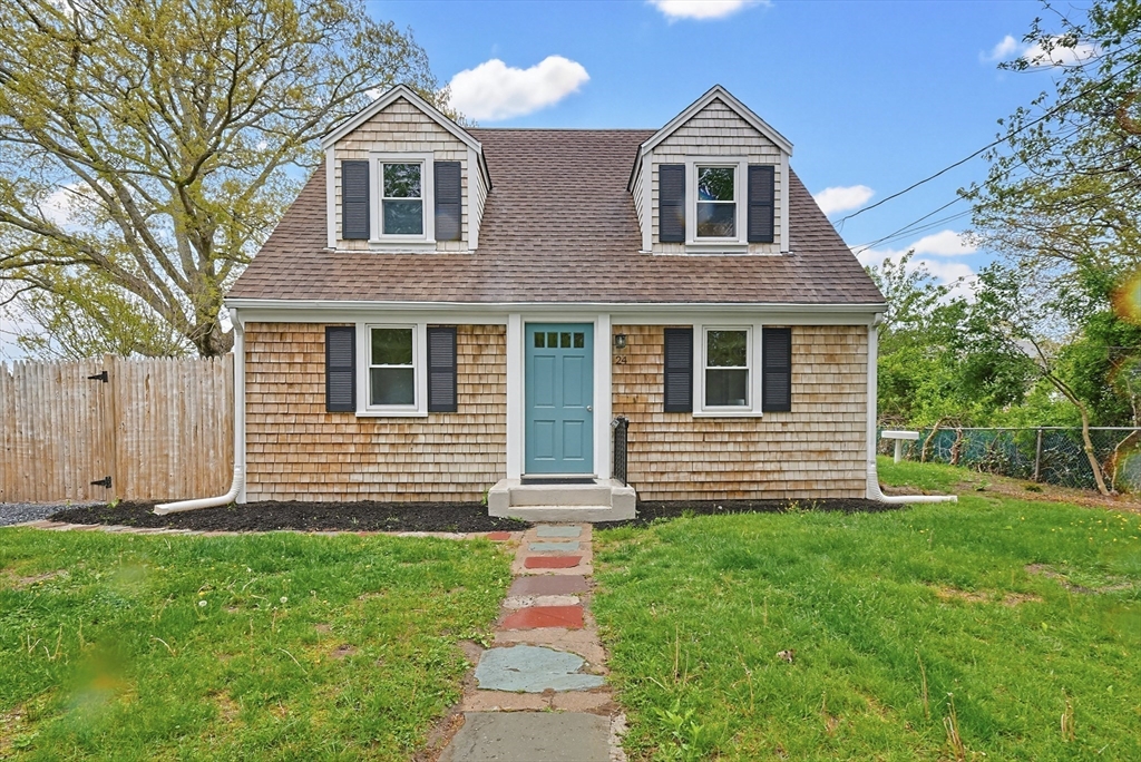 24 Otis Road Barnstable, MA 02601 - Photo 1 of 33 a front view of a house with a yard
