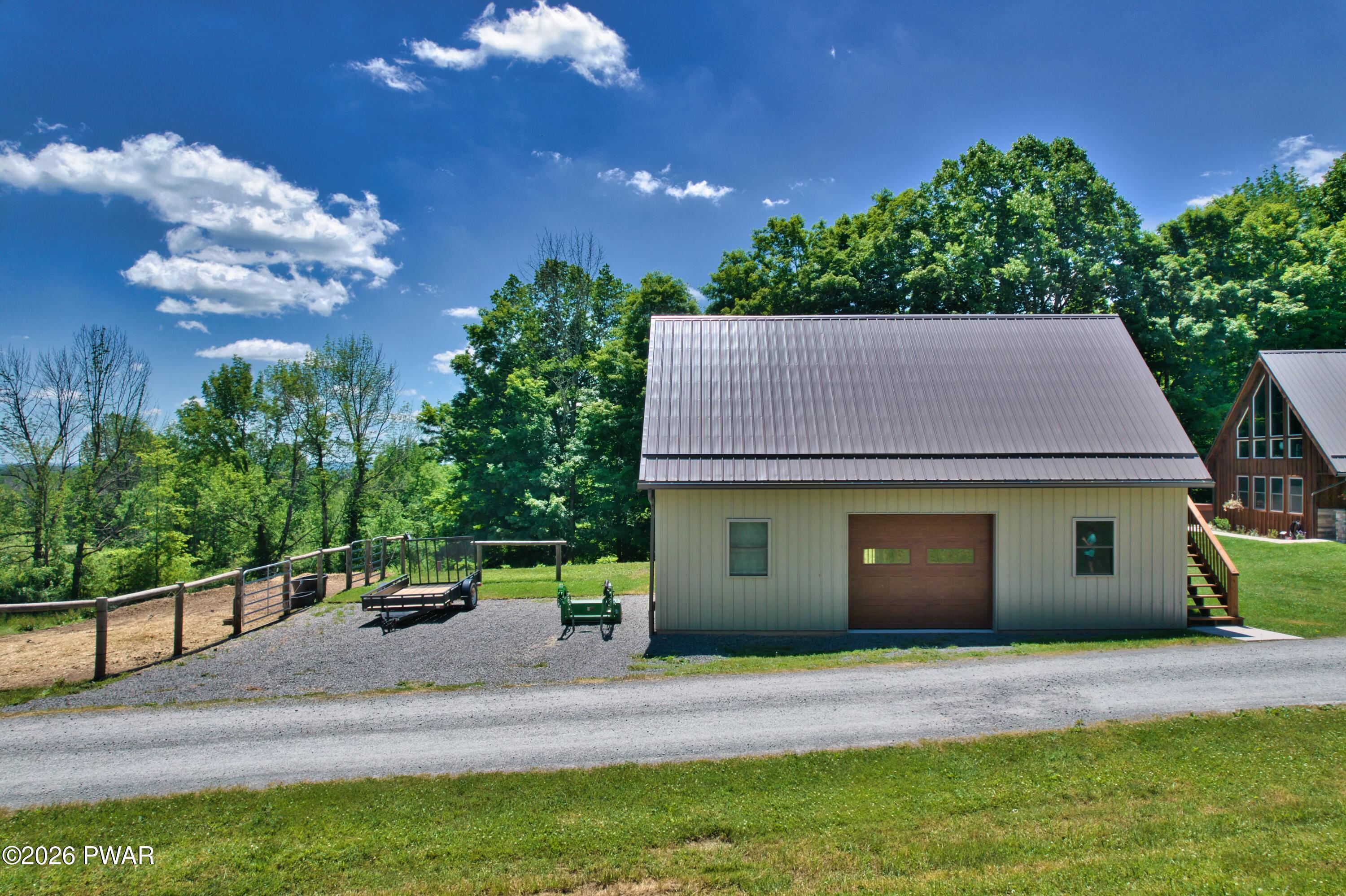 149 Sheards Road Milanville, PA 18443 - Photo 16 of 57 a house view with a garden space