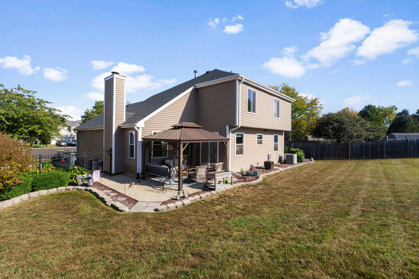 9 Arthur Court Streamwood, IL 60107 - Photo 17 of 21 a front view of a house with a yard and table and chairs
