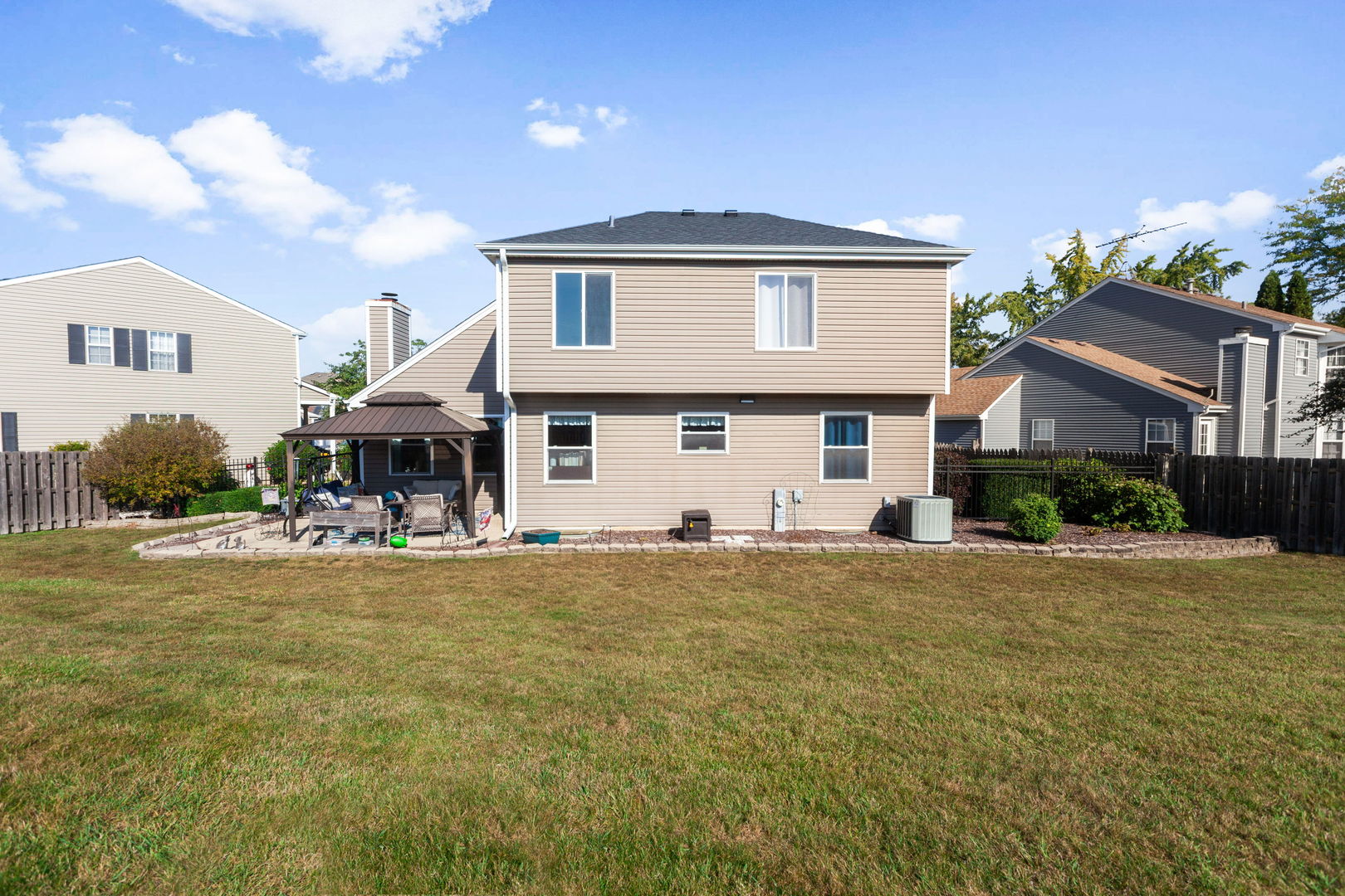 9 Arthur Court Streamwood, IL 60107 - Photo 19 of 21 a front view of a house with a garden and parking