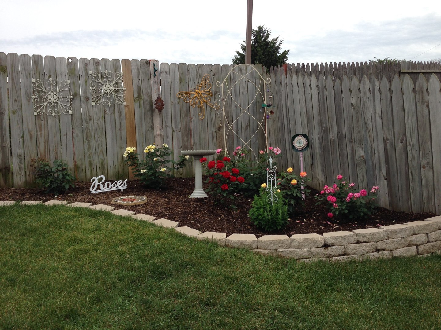 9 Arthur Court Streamwood, IL 60107 - Photo 21 of 21 a view of garden with flowers and wooden fence