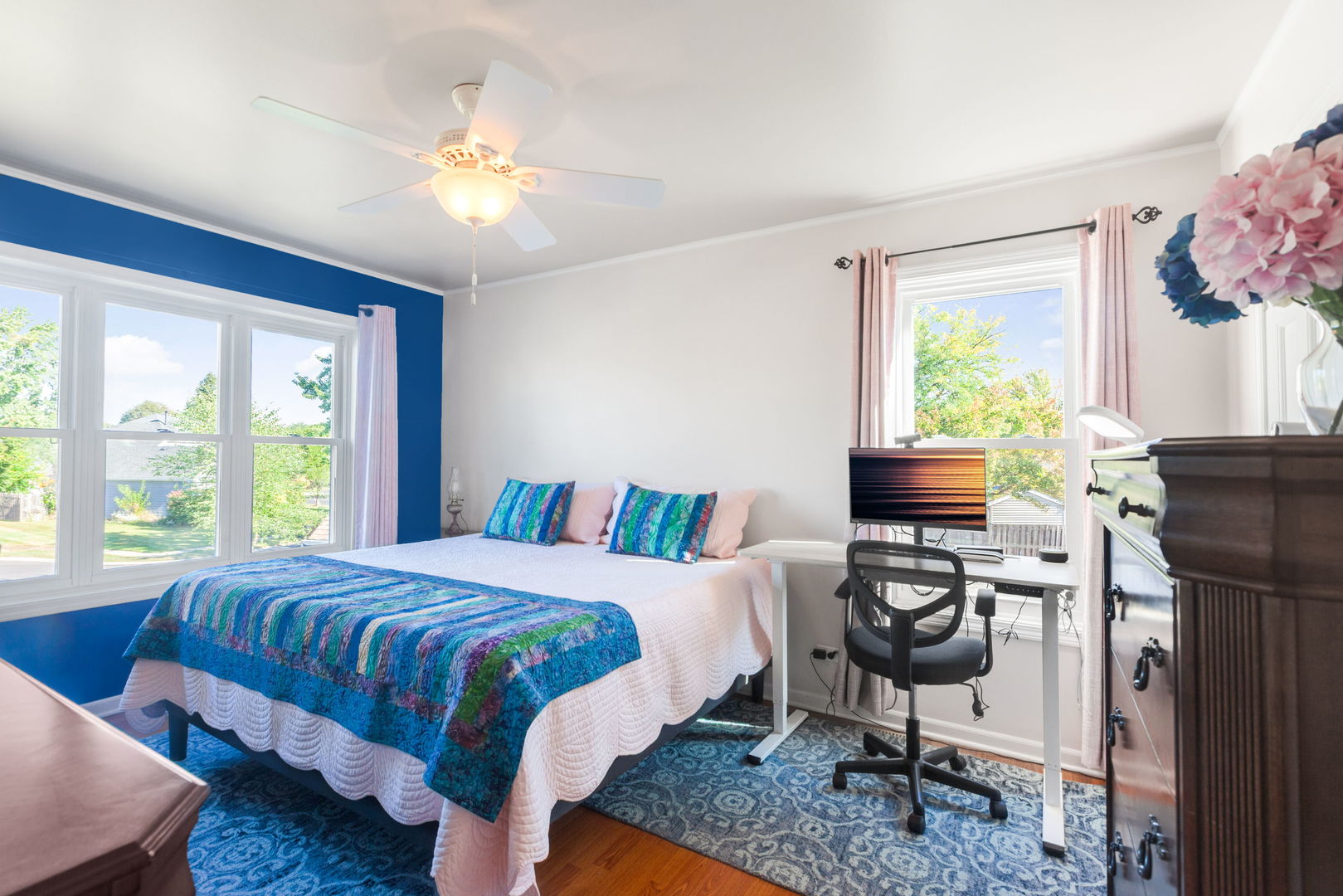 9 Arthur Court Streamwood, IL 60107 - Photo 7 of 21 a bedroom with a bed and a chandelier