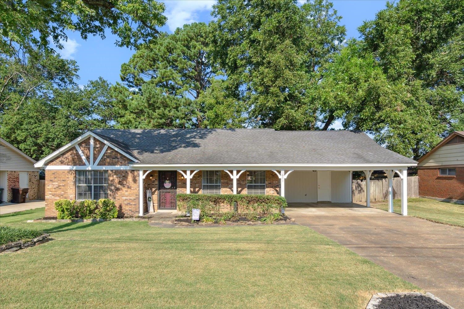 3093 Altruria Road Bartlett, TN 38134 - Photo 1 of 26 a view of a white house with a big yard plants and large trees