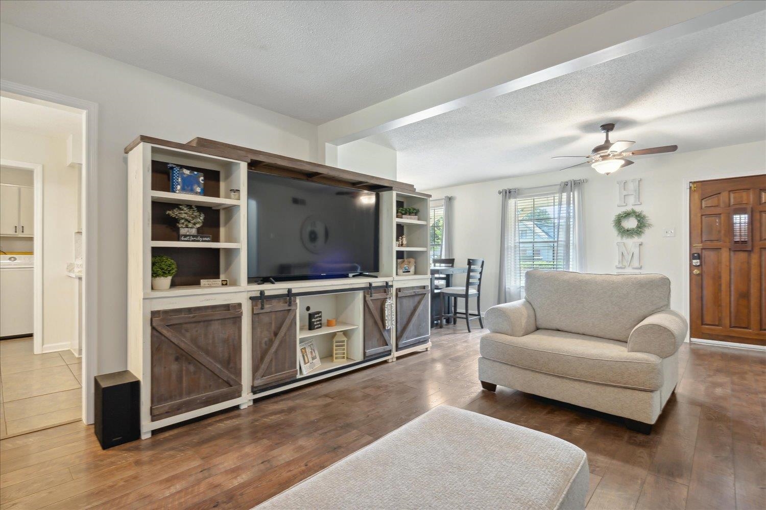 3093 Altruria Road Bartlett, TN 38134 - Photo 11 of 26 a living room with furniture and a flat screen tv
