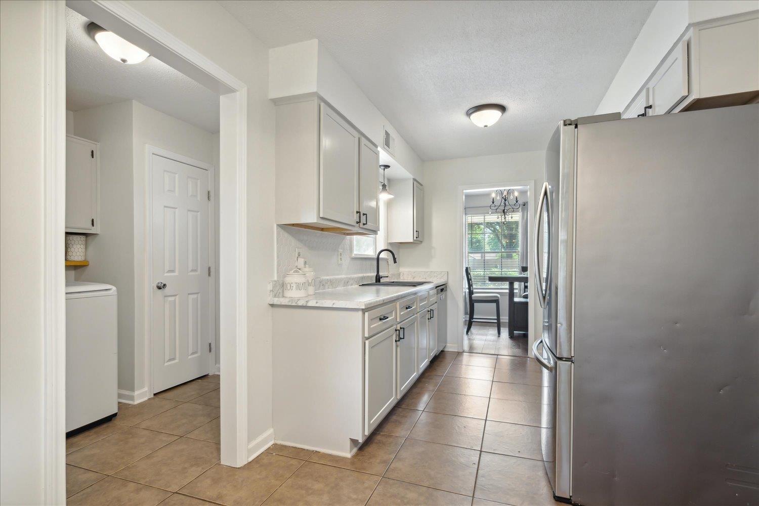 3093 Altruria Road Bartlett, TN 38134 - Photo 15 of 26 a kitchen with stainless steel appliances granite countertop a refrigerator and a sink