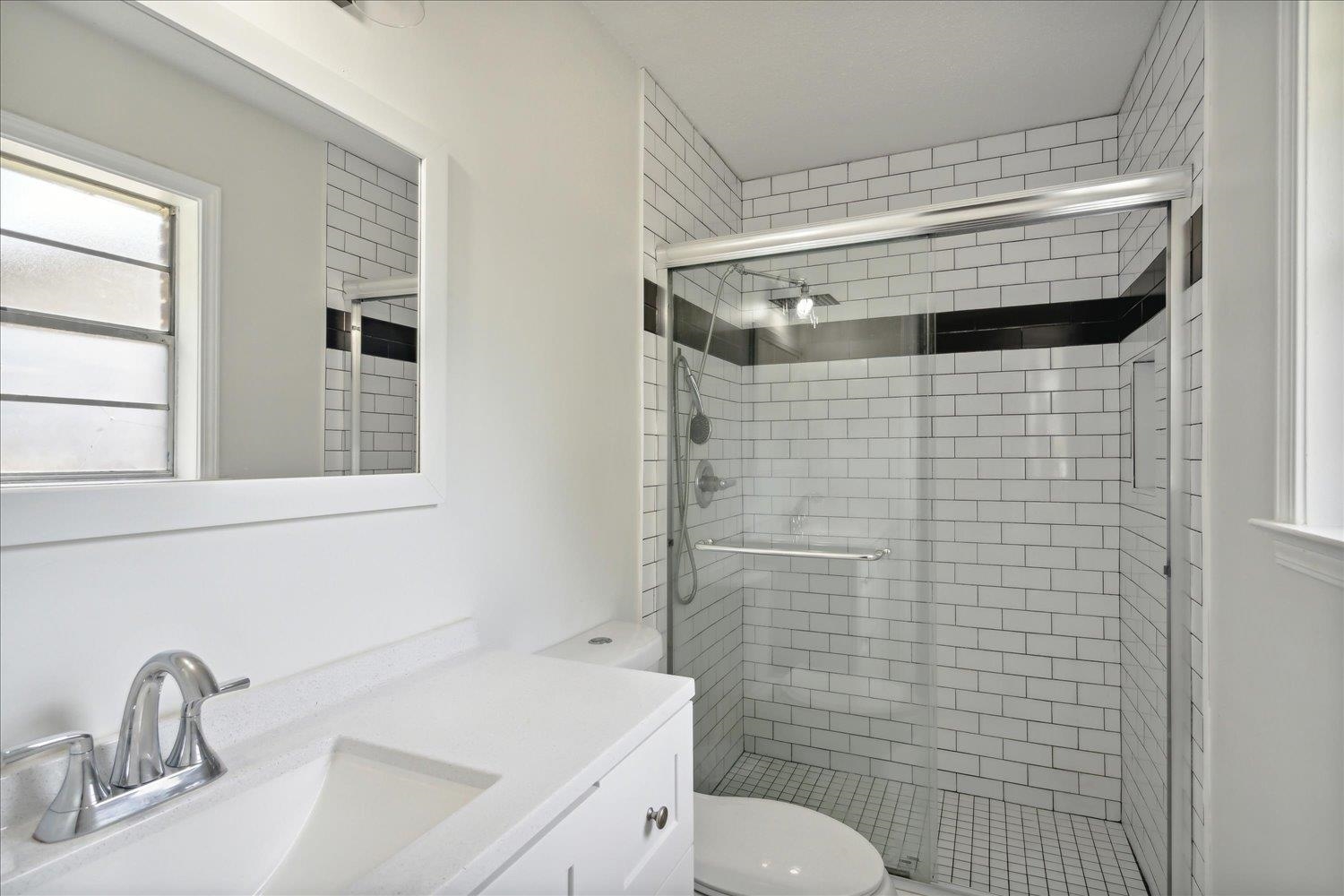 3093 Altruria Road Bartlett, TN 38134 - Photo 20 of 26 a bathroom with a sink a toilet and shower