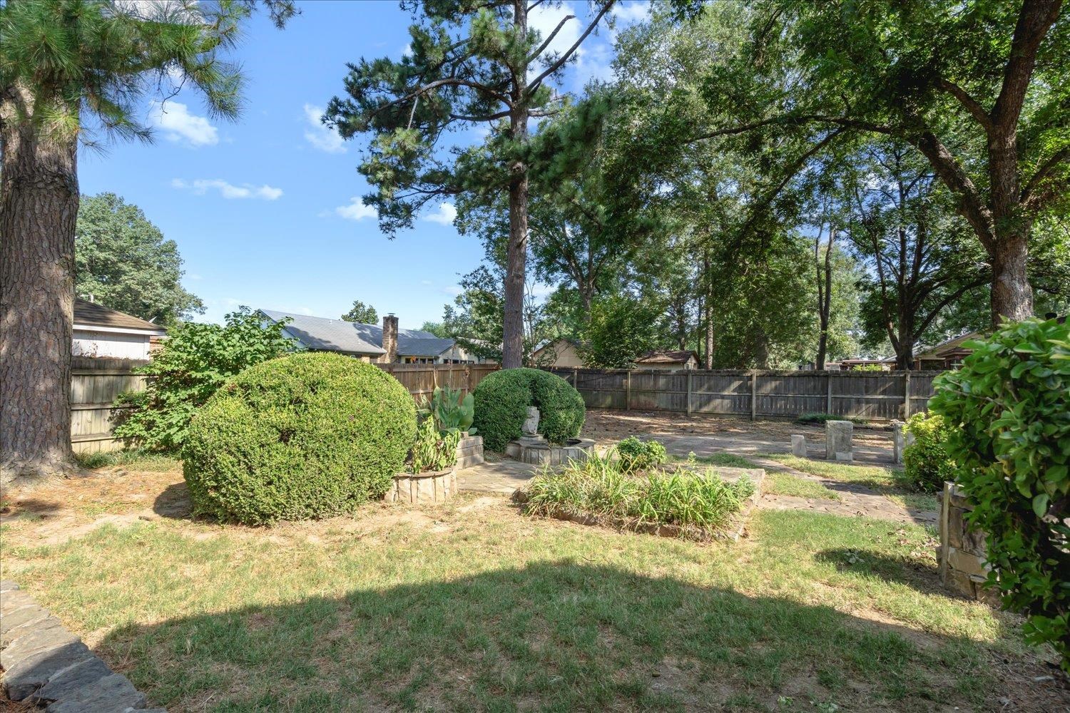 3093 Altruria Road Bartlett, TN 38134 - Photo 25 of 26 a view of a garden with a tree
