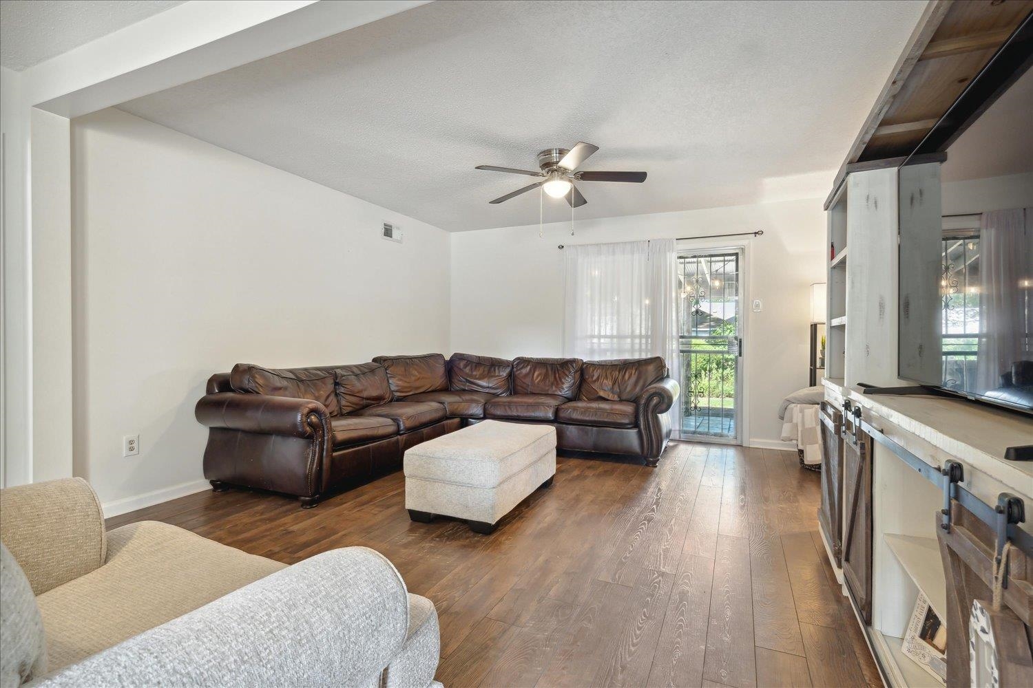 3093 Altruria Road Bartlett, TN 38134 - Photo 9 of 26 a living room with furniture and a flat screen tv