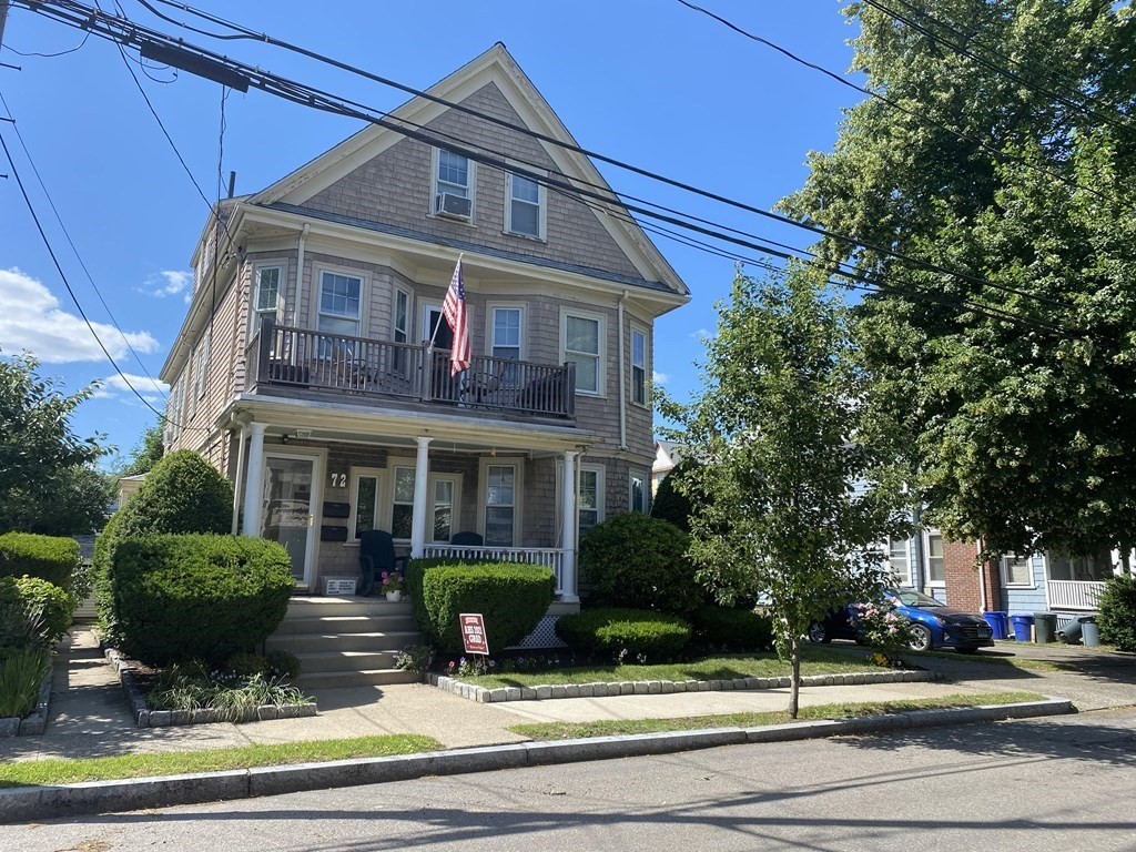 a front view of a house with porch and porch