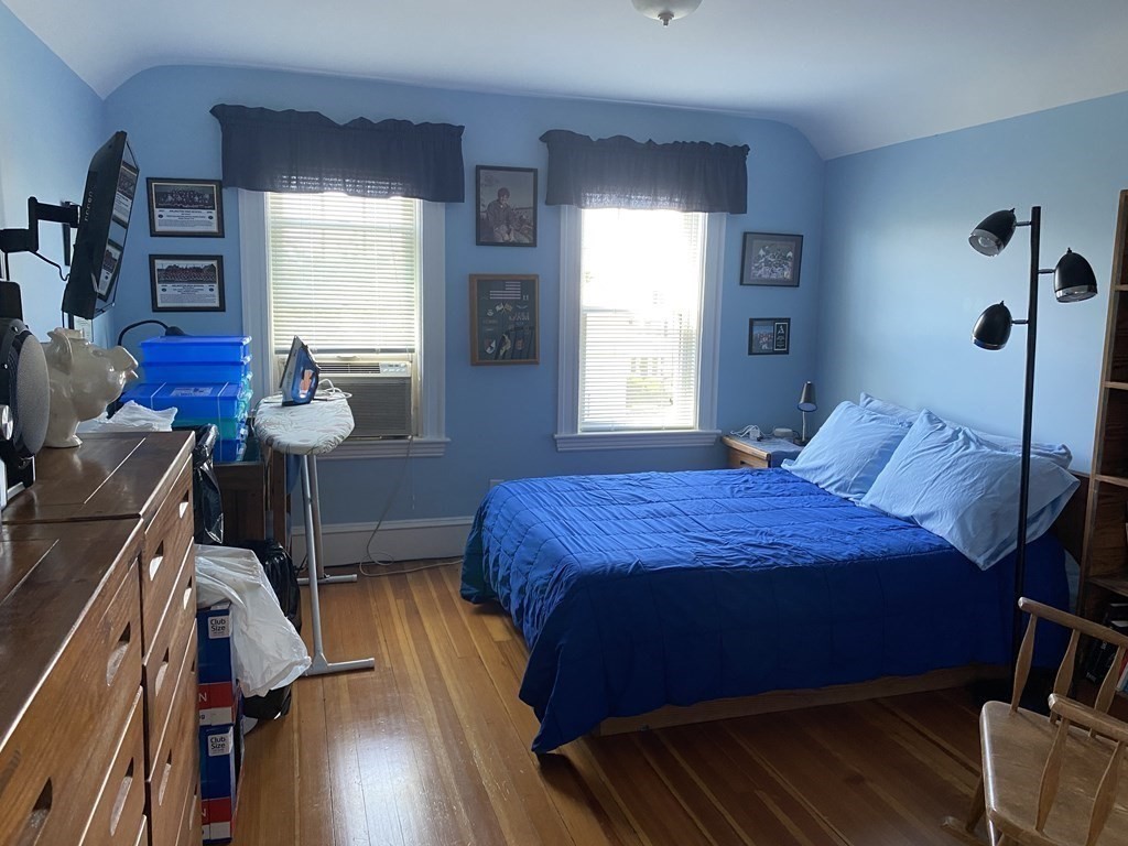 72 Everett Street Arlington, MA 02474 - Photo 11 of 25 a bedroom with a bed and a window