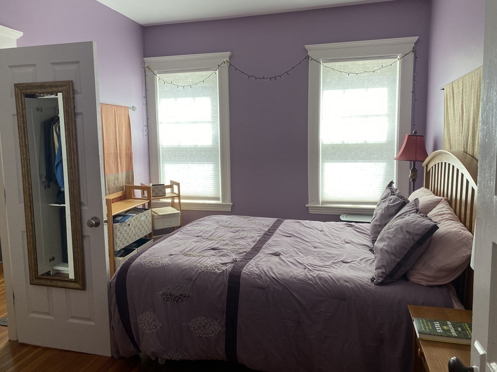 72 Everett Street Arlington, MA 02474 - Photo 12 of 25 a bedroom with a bed and a window