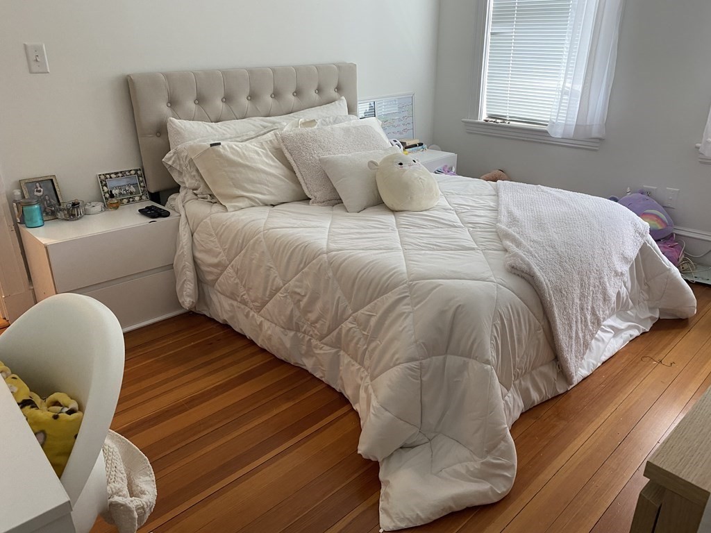 72 Everett Street Arlington, MA 02474 - Photo 13 of 25 a bedroom with a bed and window