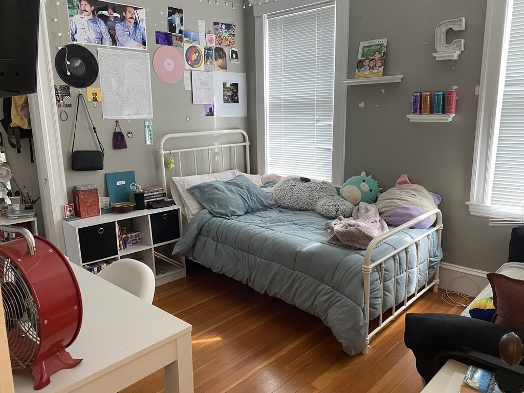 72 Everett Street Arlington, MA 02474 - Photo 14 of 25 a bedroom with furniture and a bed