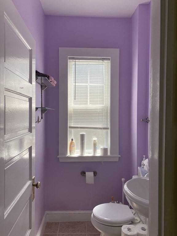 72 Everett Street Arlington, MA 02474 - Photo 22 of 25 a bathroom with a toilet sink and mirror