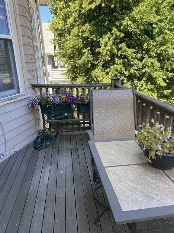 72 Everett Street Arlington, MA 02474 - Photo 25 of 25 a wooden floor with a bench