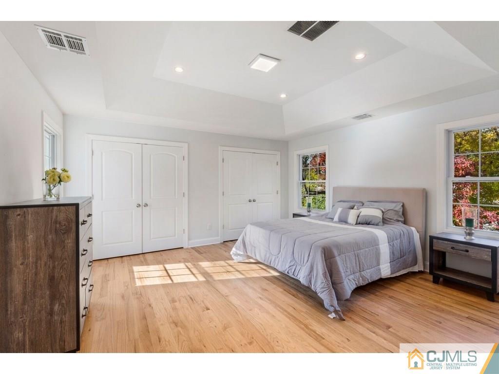 80 Lancaster Road Colonia, NJ 07067 - Photo 11 of 15 a bedroom with a bed and window