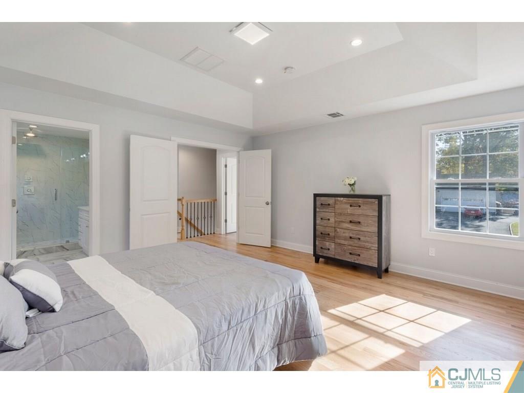 80 Lancaster Road Colonia, NJ 07067 - Photo 12 of 15 a bedroom with a bed and a dresser