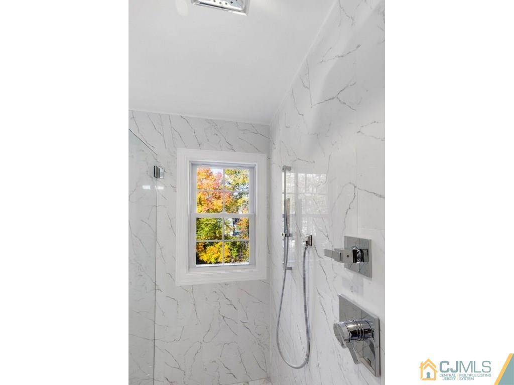 80 Lancaster Road Colonia, NJ 07067 - Photo 14 of 15 a bathroom with a sink and bathtub