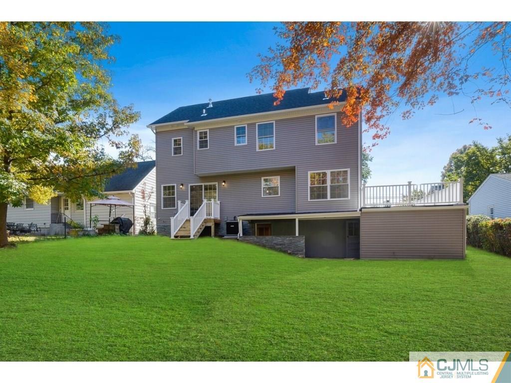 80 Lancaster Road Colonia, NJ 07067 - Photo 15 of 15 a front view of a house with a yard