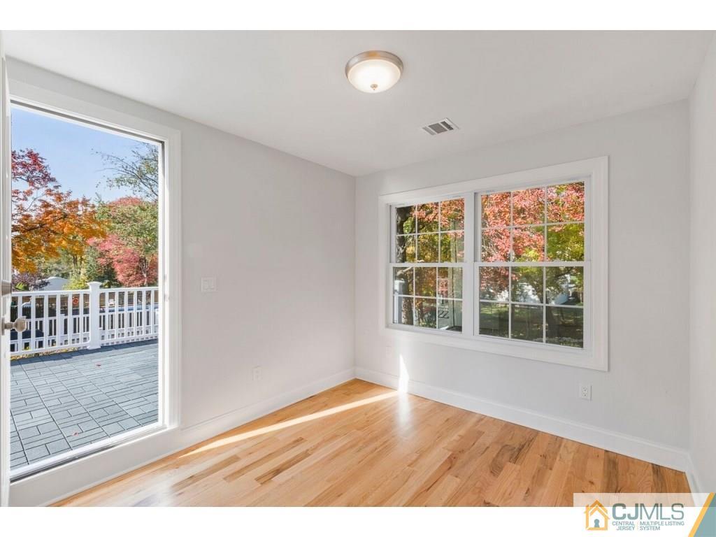 80 Lancaster Road Colonia, NJ 07067 - Photo 8 of 15 a view of an empty room with a window