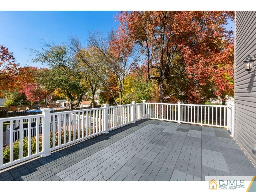80 Lancaster Road Colonia, NJ 07067 - Photo 9 of 15 a view of balcony with wooden floor