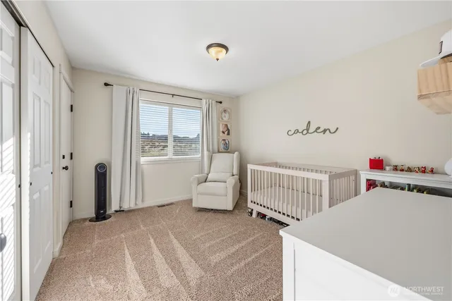 a bedroom with furniture and window