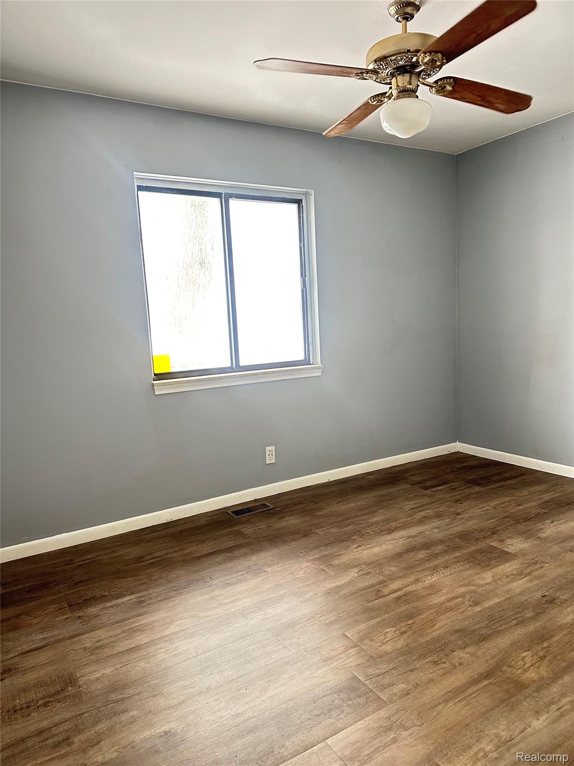 Unfurnished bedroom with LVP flooring