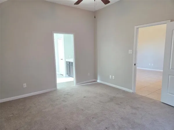 a view of an empty room and a window