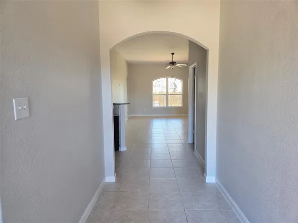 a view of hallway with windows