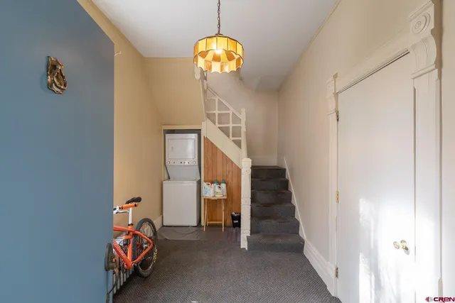 a view of a livingroom with stairs