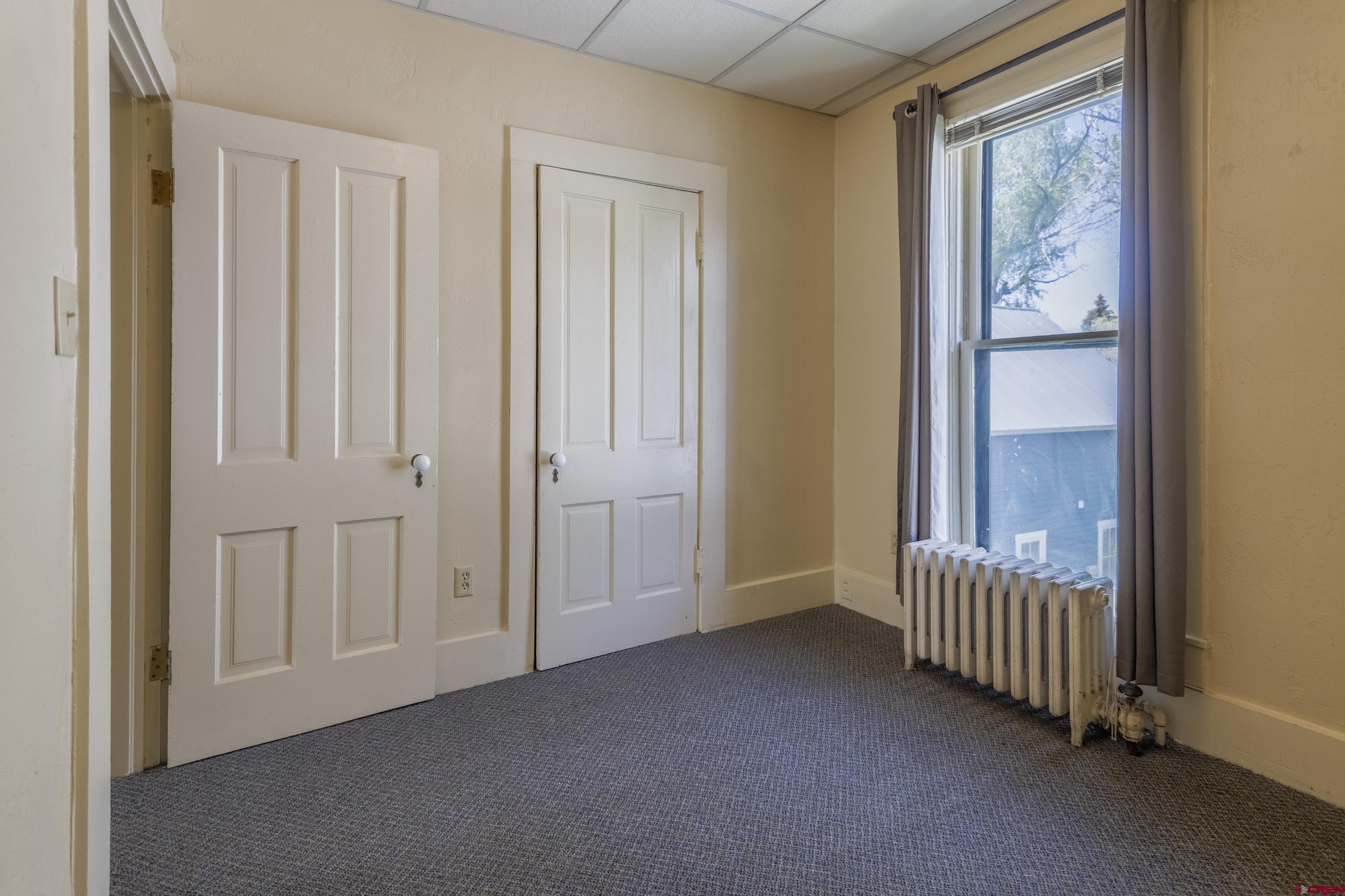 518 East Georgia Avenue Gunnison, CO 81230 - Photo 15 of 40 an empty room with windows