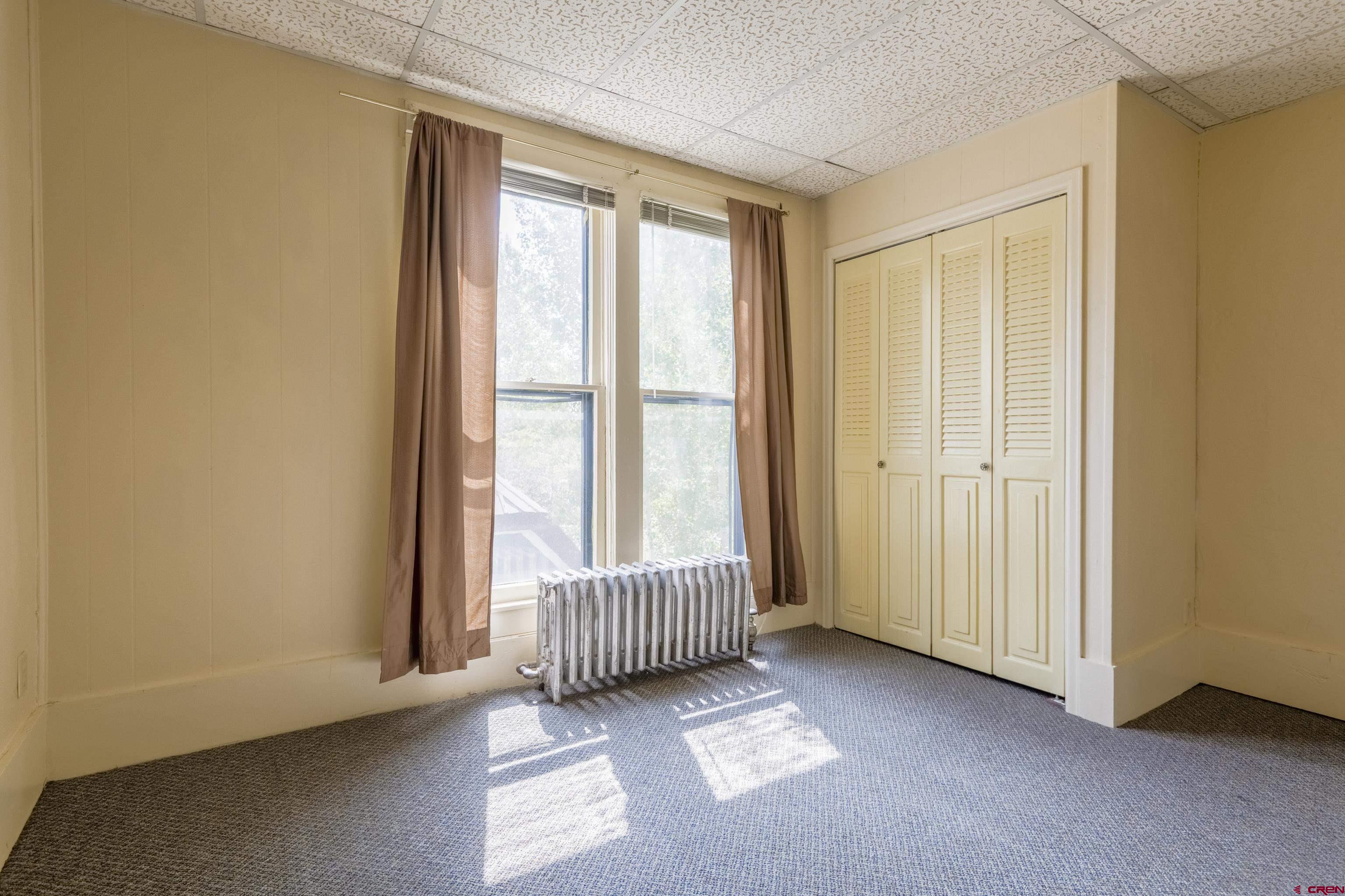518 East Georgia Avenue Gunnison, CO 81230 - Photo 16 of 40 an empty room with windows