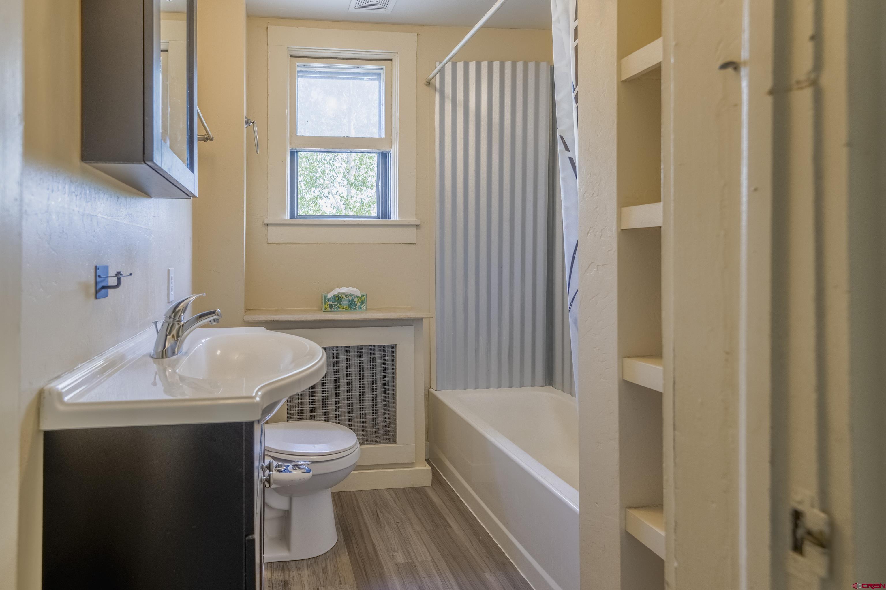 518 East Georgia Avenue Gunnison, CO 81230 - Photo 17 of 40 a bathroom with a sink toilet and shower