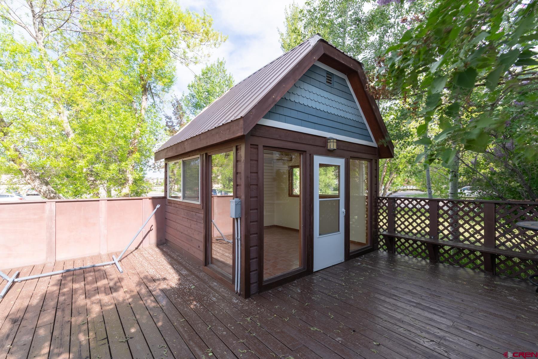 518 East Georgia Avenue Gunnison, CO 81230 - Photo 21 of 40 a view of a house with a yard and wooden floor