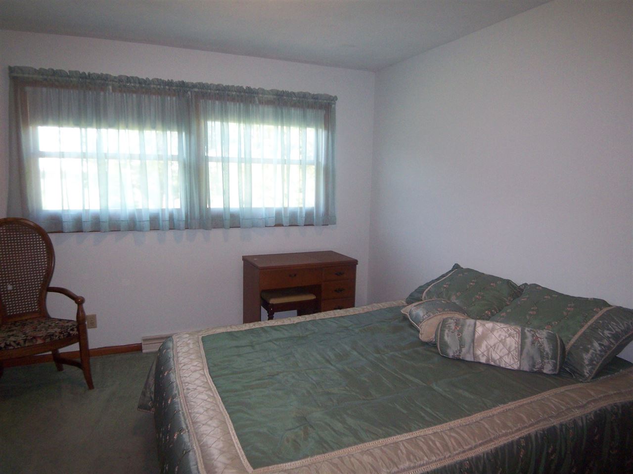 2666 South Rock City Road Ridott, IL 61067 - Photo 11 of 25 a bedroom with a bed and a window