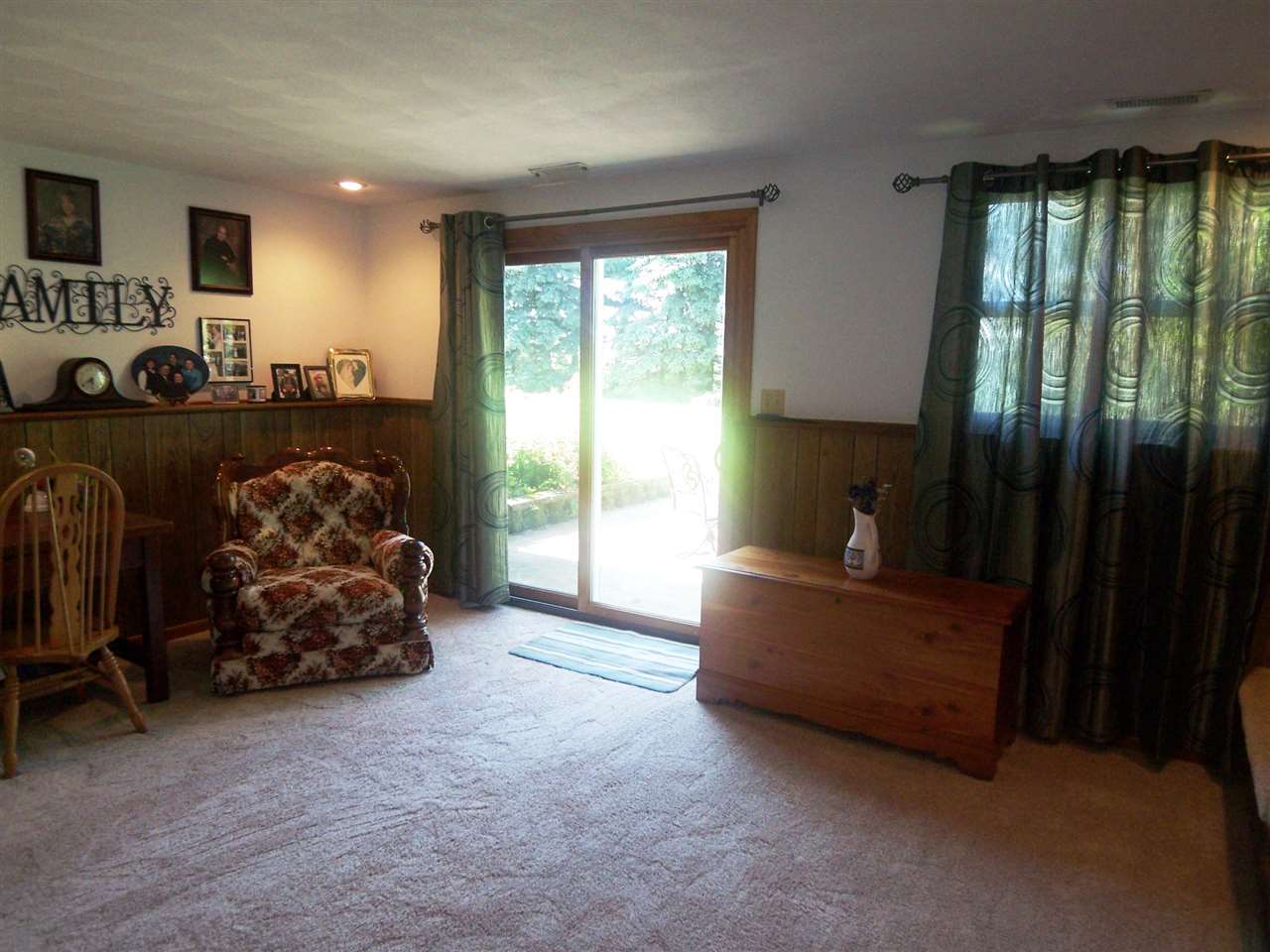 2666 South Rock City Road Ridott, IL 61067 - Photo 15 of 25 a living room with furniture and a flat screen tv