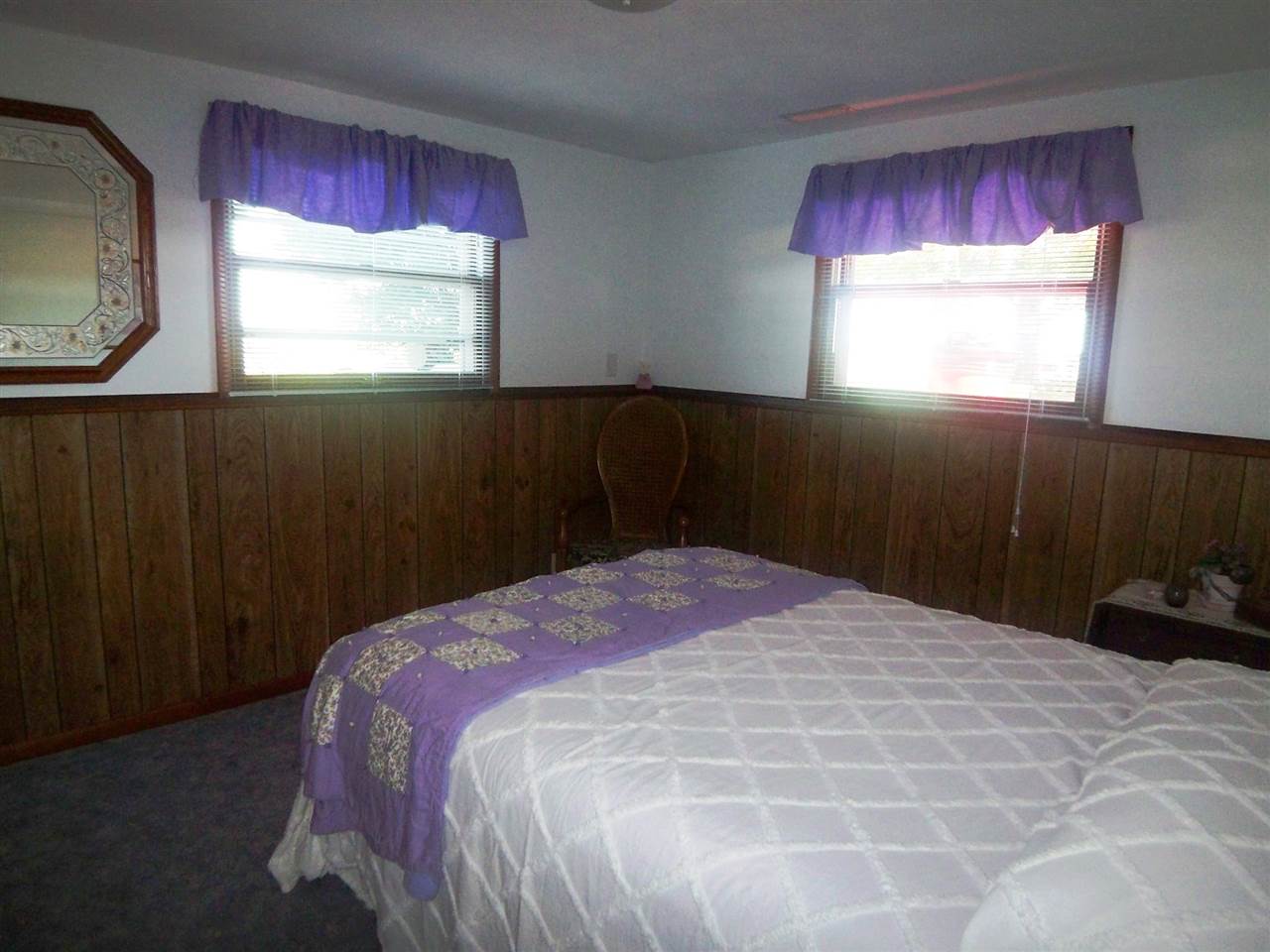 2666 South Rock City Road Ridott, IL 61067 - Photo 16 of 25 a bedroom with a bed and a window