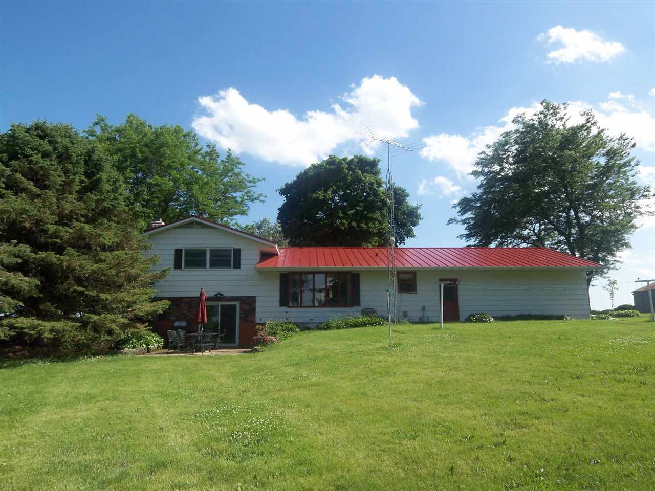 2666 South Rock City Road Ridott, IL 61067 - Photo 18 of 25 a view of a house with a yard
